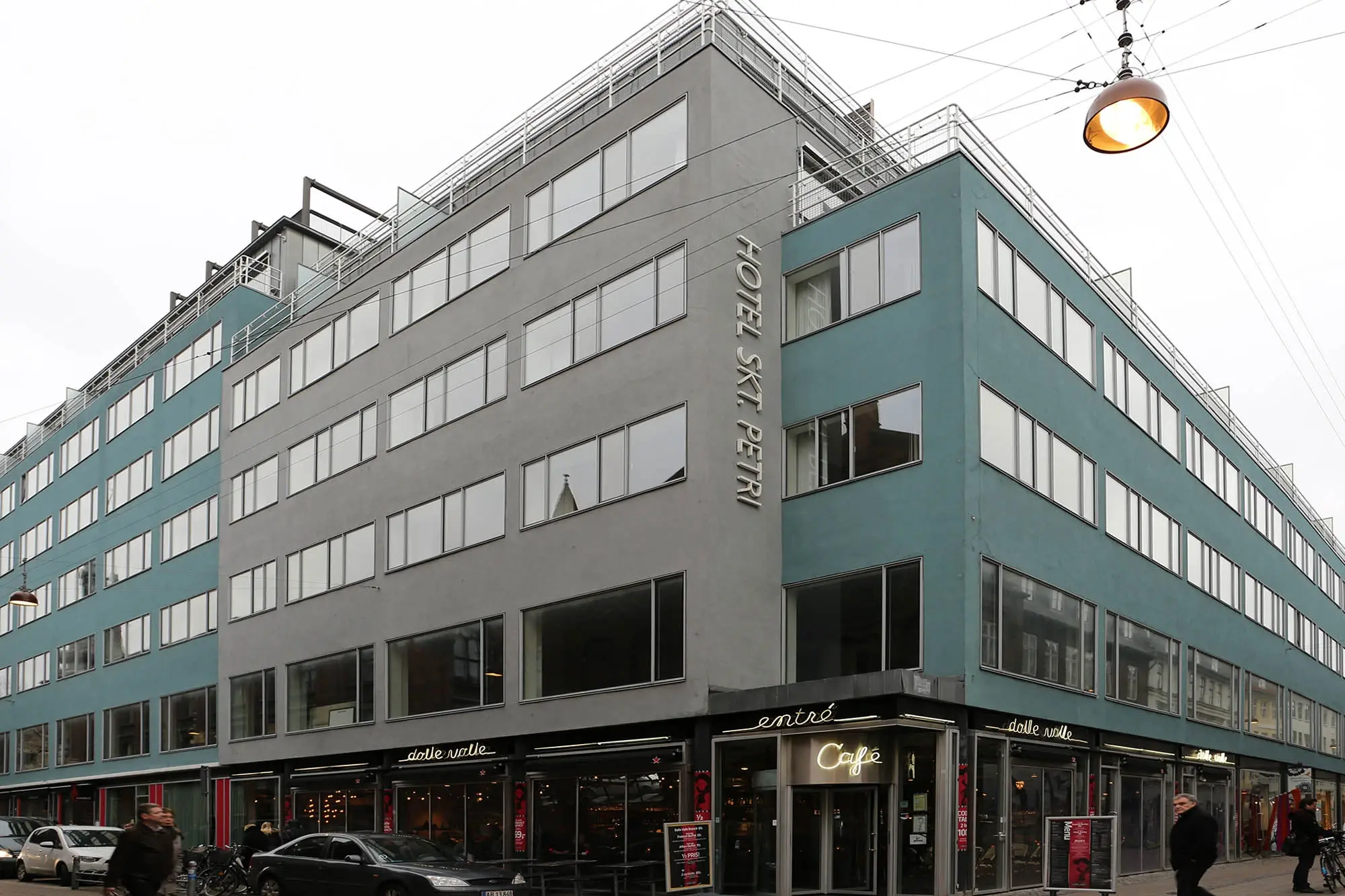 Long horizontal frontage of a converted store with banded window levels
